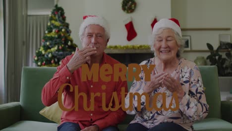 Animation-of-christmas-greetings-text-over-senior-caucasian-couple-in-santa-hats-on-sofa