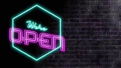 Animation-of-neon-we-are-open-text-over-black-brick-wall