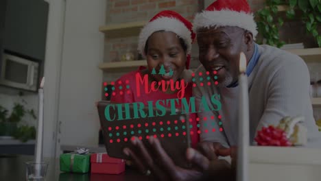 Animación-Del-Texto-De-Saludos-Navideños-Sobre-Una-Pareja-Afroamericana-Usando-Un-Teléfono-Inteligente-En-Navidad