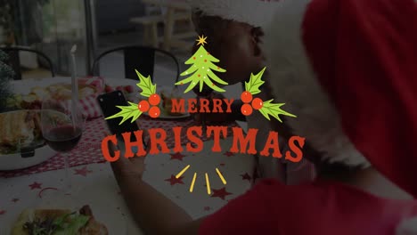 Animation-Von-Weihnachtsgrüßen-über-Einem-Afroamerikanischen-Mann,-Der-Zu-Weihnachten-Auf-Dem-Smartphone-Spricht