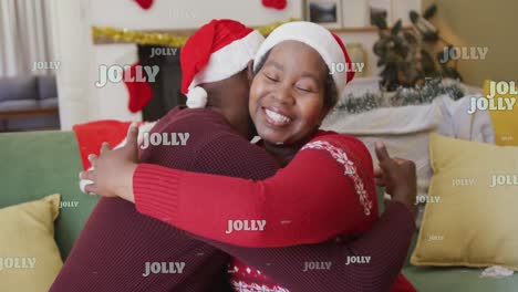 Animation-of-christmas-jolly-text-over-senior-african-american-couple-in-santa-hats-at-christmas