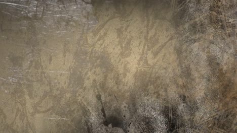 Animation-of-moving-scratches-and-cracks-over-dark-background