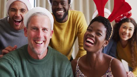 Happy-group-of-diverse-friends-having-video-call-at-christmas-party