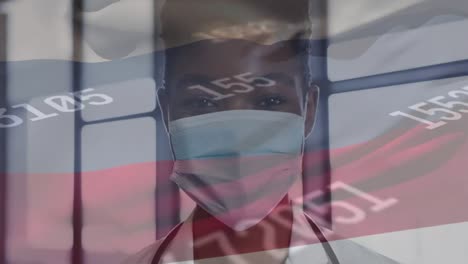 Animation-of-flag-of-russia-and-data-processing-over-african-american-female-doctor