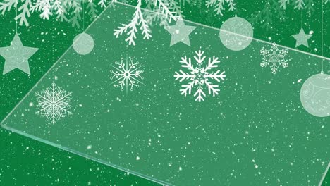 Animation-of-snow-falling-over-christmas-baubles-on-green-background