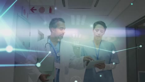 Animation-of-dots-connecting-with-lines-and-caucasian-doctors-discussing-over-tablet-in-corridor