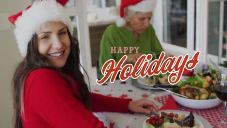 Animation-of-happy-christmas-text-over-caucasian-family-wearing-santa-hats