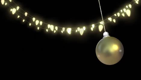 Animation-of-christmas-bauble-dangling-over-fairy-lights-on-black-background
