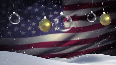 Animation-of-christmas-baubles-dangling-over-flag-of-usa-and-snow-falling-in-background