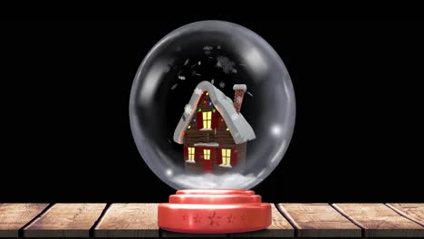 Animation-of-christmas-snow-globe-with-snow-falling-and-house-on-black-background
