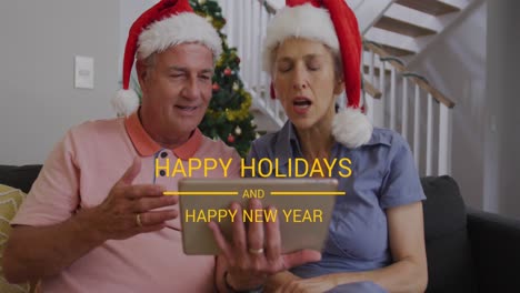 Animation-of-happy-holidays-and-happy-new-year-text-over-senior-caucasian-couple-wearing-santa-hats