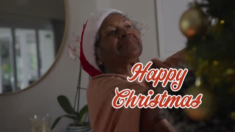 Animation-of-merry-christmas-text-over-senior-african-american-woman-wearing-santa-hats