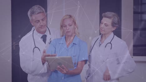 Animation-of-caucasian-doctors-with-tablet-over-network-of-connections