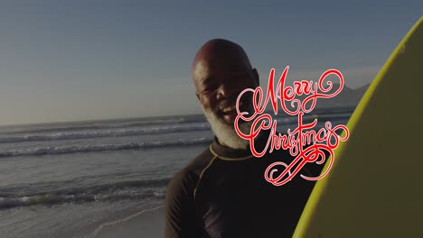 Animation-of-merry-christmas-text-over-senior-african-american-man-at-beach
