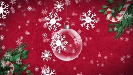 Animation-of-christmas-bauble-dangling-over-snow-falling-on-red-background