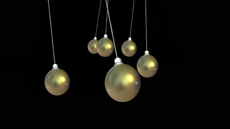 Animation-of-christmas-gold-baubles-dangling-over-black-background
