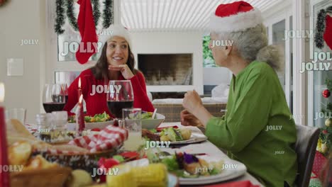 Animation-of-jolly-text-over-caucasian-family-wearing-santa-hats