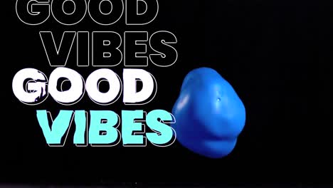 Animation-of-good-vibes-text-and-balloon-on-black-background