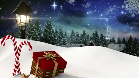 Animation-of-snow,-night-winter-landscape,-lantern-and-present