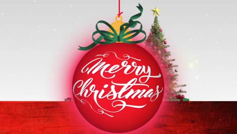 Animation-of-snow-falling-over-bauble-with-merry-christmas-text-and-christmas-tree