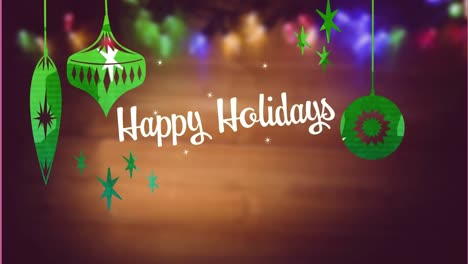 Animation-of-happy-holidays-text-over-christmas-decorations