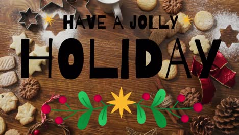 Animation-of-have-a-jolly-holiday-text-over-christmas-cookies-and-decorations-on-wooden-background