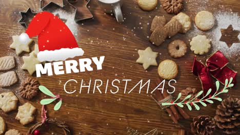 Animation-of-merry-christmas-text-over-christmas-cookies-and-decorations-on-wooden-background