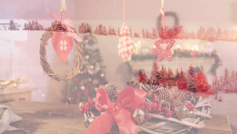 Animation-of-winter-scenery-over-christmas-decorations