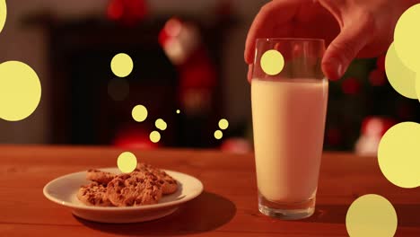 Animation-Von-Punkten,-Die-Sich-Für-Den-Weihnachtsmann-über-Milch-Und-Kekse-Bewegen