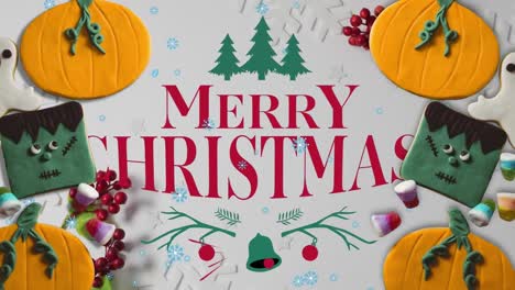 Animation-of-merry-christmas-over-halloween-and-christmas-decorations-on-white-surface