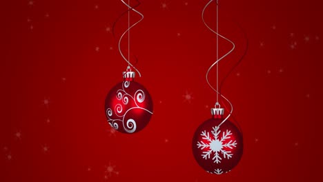 Animation-Von-Schneeflocken-über-Weihnachtskugeln-Auf-Rotem-Hintergrund