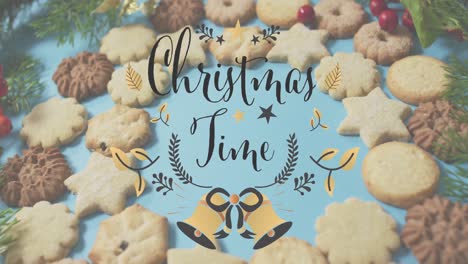 Animation-of-christmas-greetings-text-over-christmas-tree-and-cookies