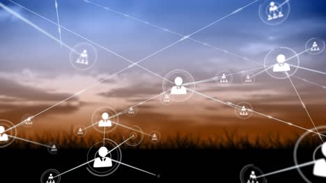 Animation-of-network-of-profile-icons-against-landscape-with-grassland-against-sunset-sky