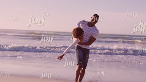 Animation-of-christmas-greetings-text-over-african-american-with-son-on-beach