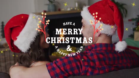 Animation-of-christmas-greetings-text-with-diverse-couple-in-santa-hats-at-christmas