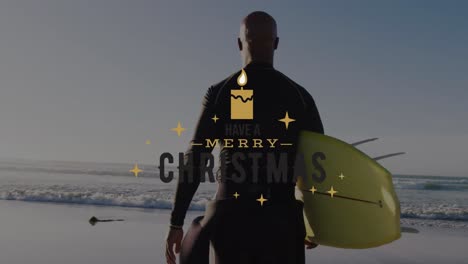 Animation-of-christmas-greetings-text-over-african-american-man-with-surfboard-on-beach