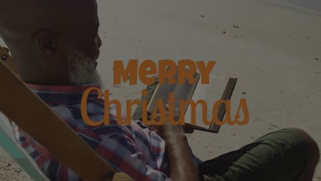 Animation-of-christmas-greetings-text-over-african-american-senior-man-on-beach