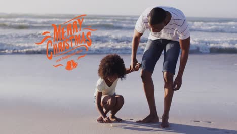 Animation-of-christmas-greetings-text-over-african-american-father-and-daughter-on-beach