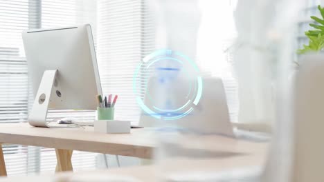 Animation-of-neon-round-scanner-against-equipment-on-office-desk