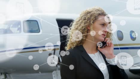 Animation-of-network-of-connections-over-caucasian-businesswoman-talking-on-smartphone