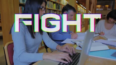 Animation-of-fight-text-over-diverse-people-using-laptop