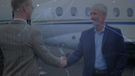 Animation-of-network-of-connections-over-businessmen-by-plane