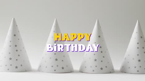 Animation-of-happy-birthday-text-over-party-hats-in-background