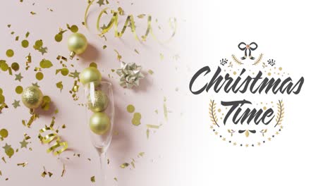 Animation-of-christmas-greetings-text-over-christmas-baubles-in-champagne-glass