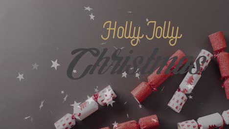 Animation-of-christmas-greetings-text-over-christmas-crackers