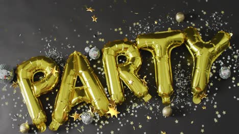 Animation-of-party-balloon-text-over-confetti-and-stars