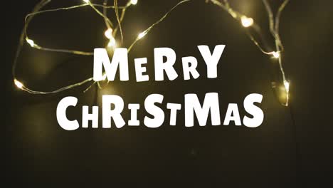 Animation-of-christmas-greetings-text-over-christmas-fairy-lights