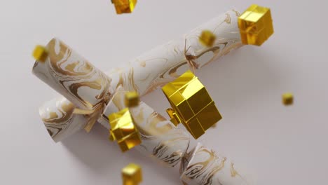Animation-of-christmas-crackers-and-presents-falling-on-white-background
