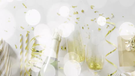 Animation-of-confetti-and-champagne-bottle-with-glasses