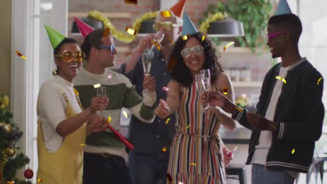 Animation-of-confetti-over-diverse-friends-smiling-at-party